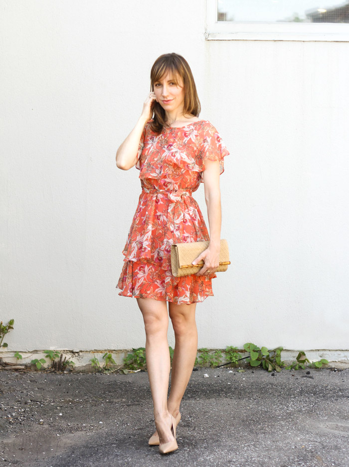 black dress and orange shoes