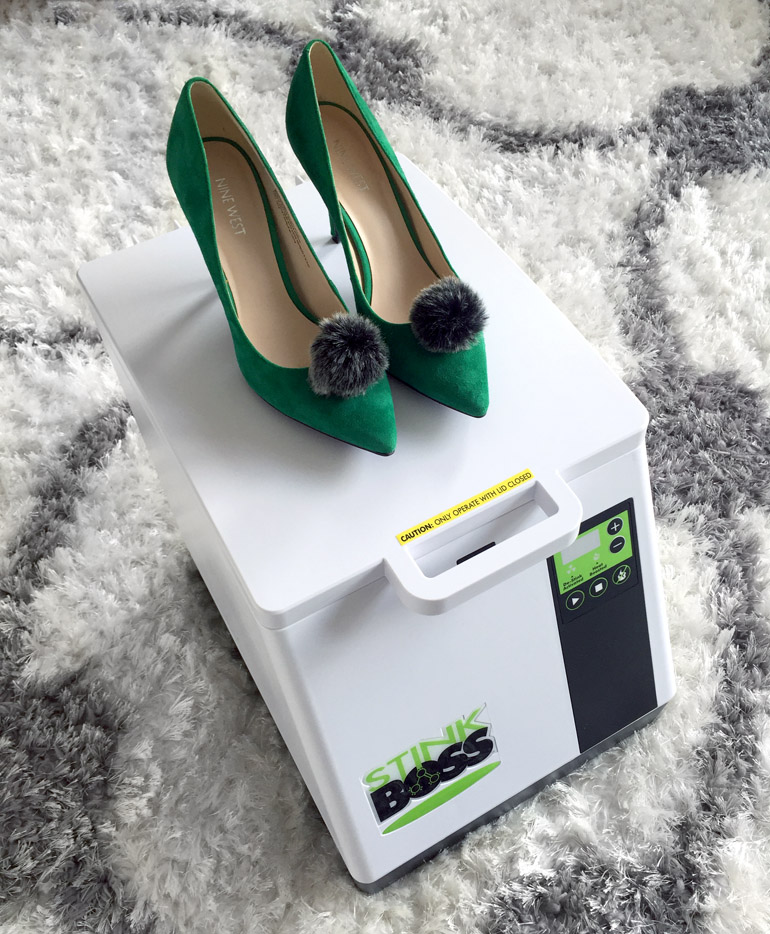 Green high heel pumps on top of Stinkboss Shoe Deodorizer and dryer machine.