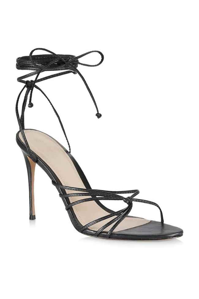 Black strappy High Heel sandals on White background.