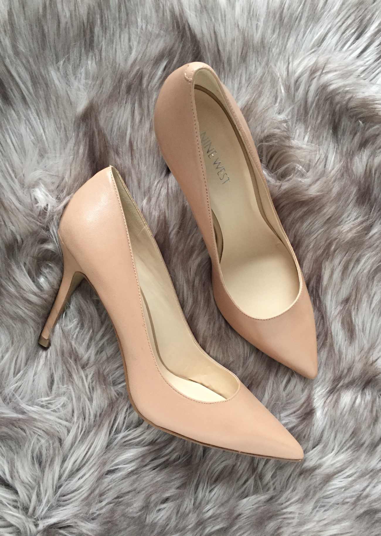 Blush Pumps Shoes that go with everything, laying on a taupe carpet.