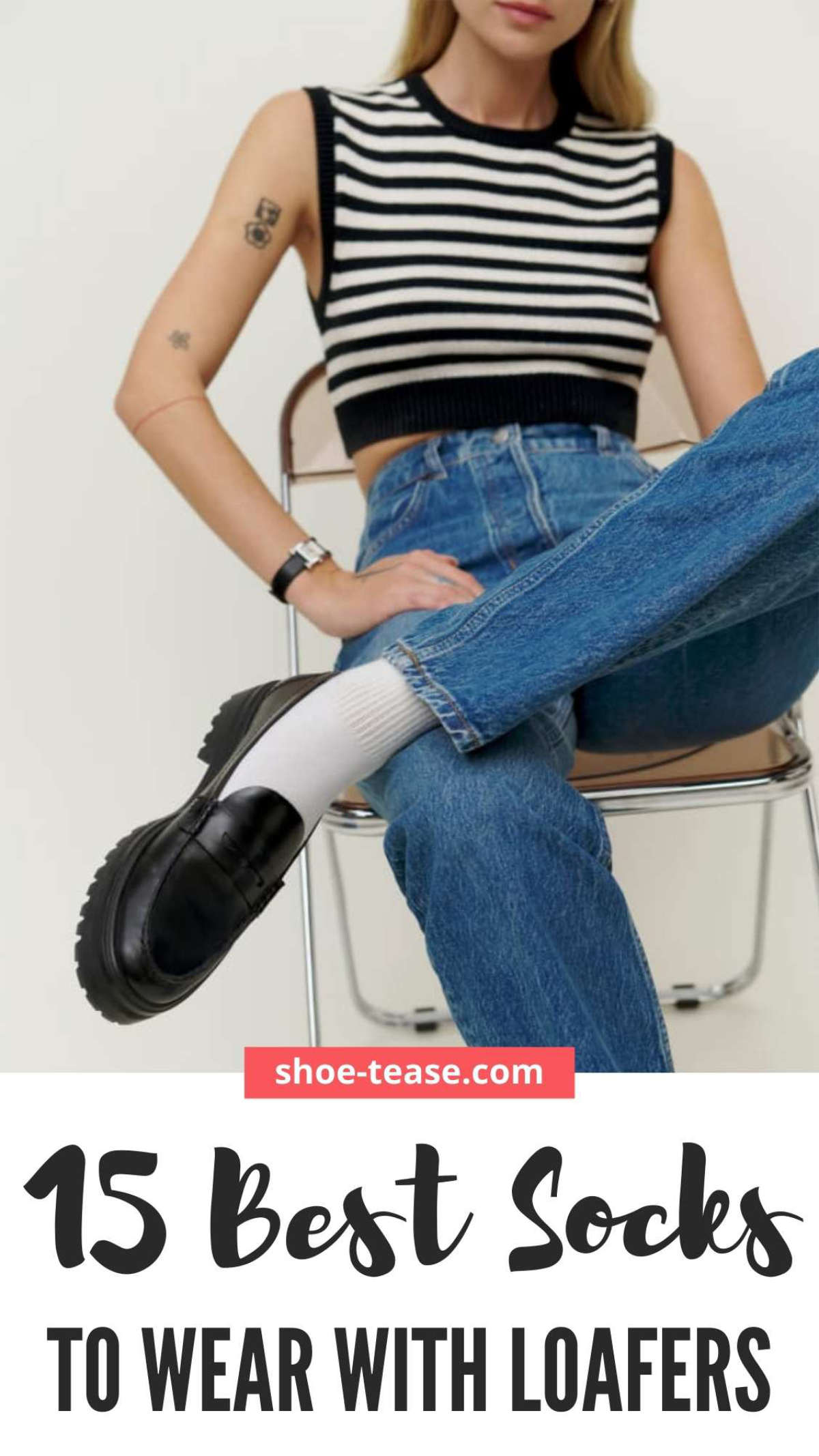 Text reading 14 best socks to wear with loafers under close up of woman sitting on chair wearing white socks with black loafers, straight leg jeans and a black and white striped cropped vest.