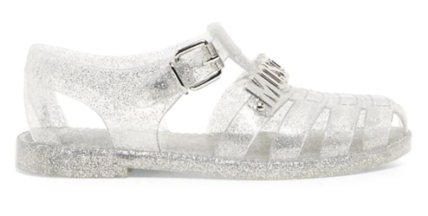 Clear silver glitter jelly sandals with moschino silver logo on white background.