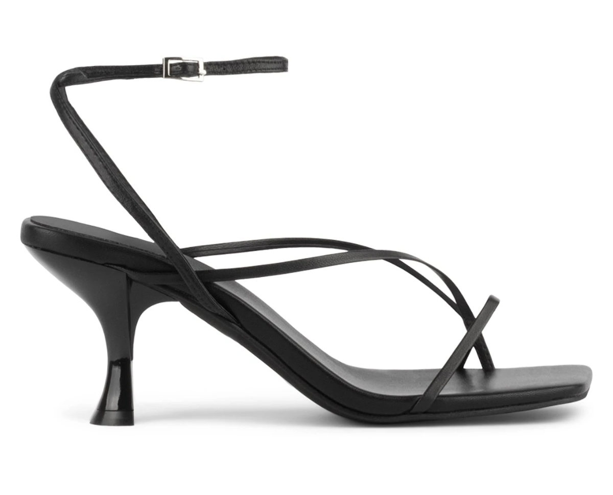 Black floss sandals with curved kitten heel and ankle strap.