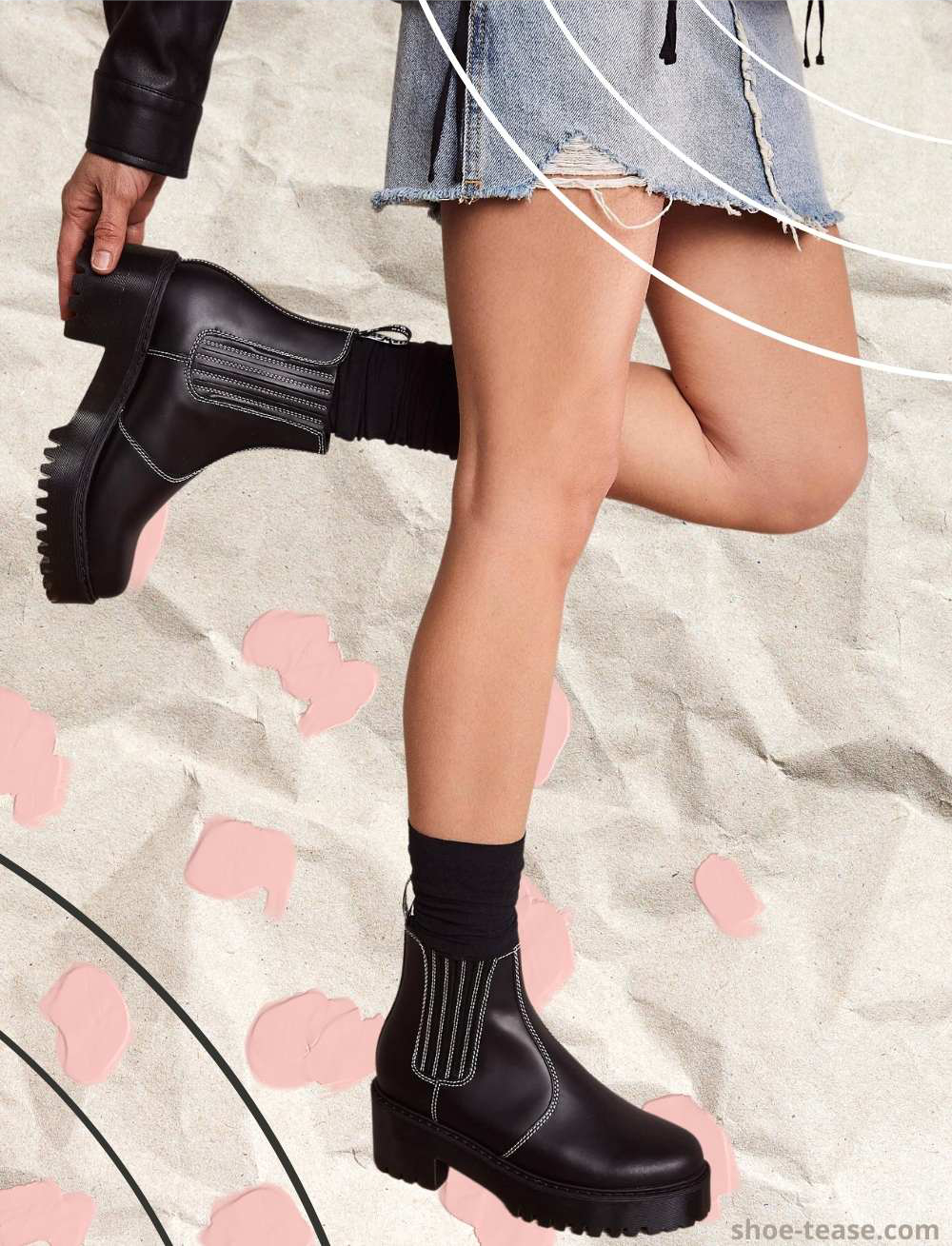 Cropped view of woman's legs wearing a chelsea boots outfit with black socks and a distressed denim midi skirt.
