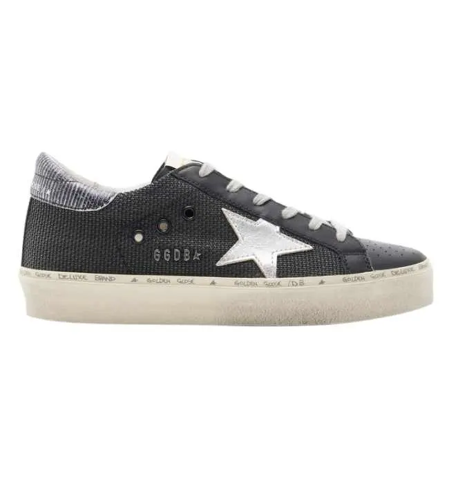 One Black Golden Goose Hi star sneakers with silver star on white background.