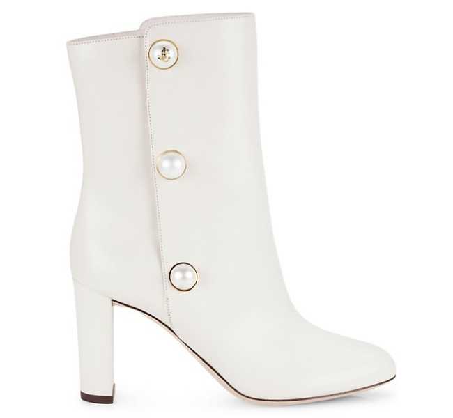White ankle boot with pearls on white background.