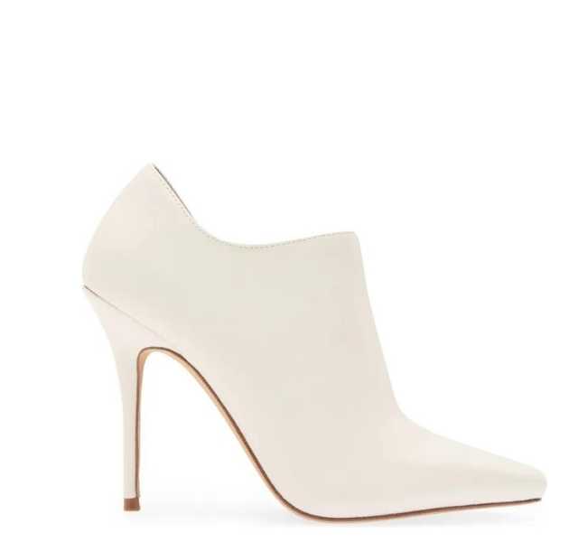 Off-white ankle bootie with stiletto heel on white background.