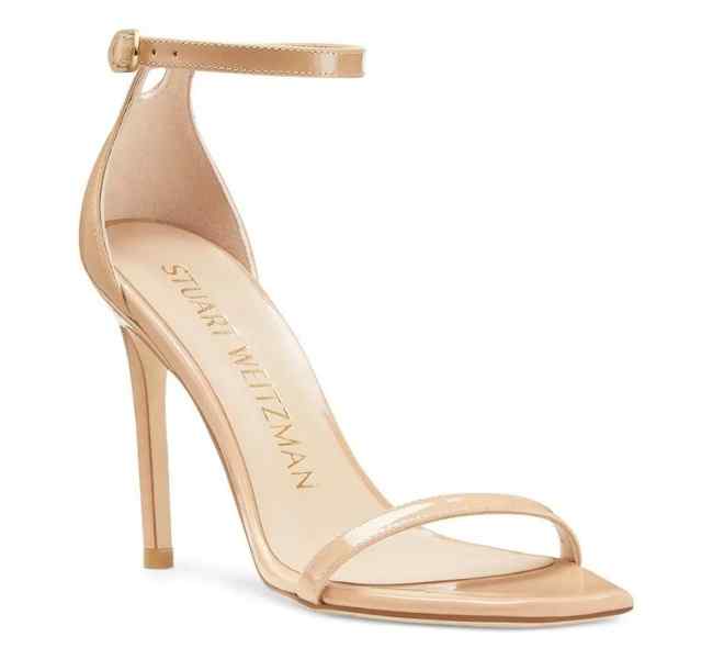 Patent Beige leather stiletto heel sandal on white background.