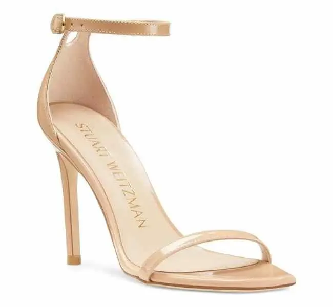 Patent Beige leather stiletto heel sandal on white background.