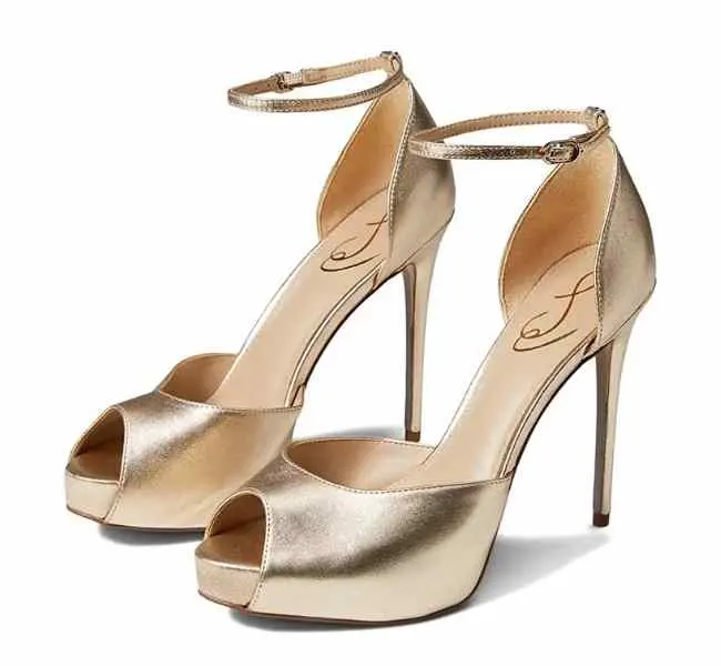 Gold peep-toe stiletto sandals on a white background.