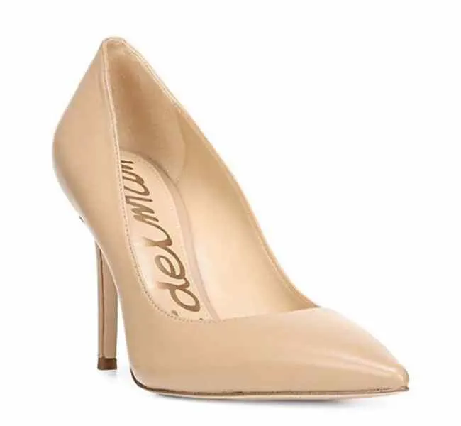 Beige leather pointed toe pumps on white background.