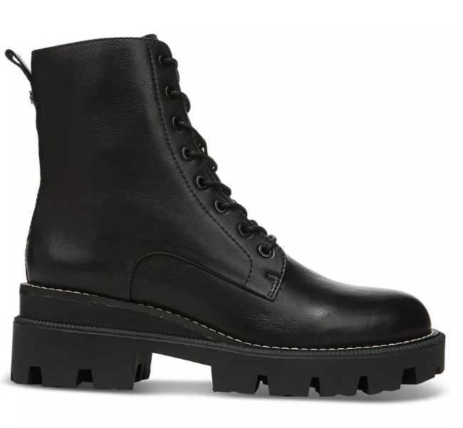 Black lug sole combat boots on white background.