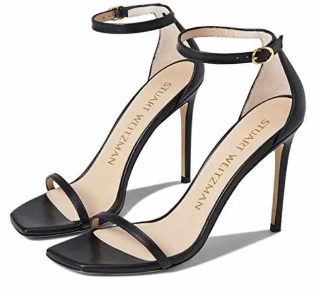 Black leather square toe adjustable ankle buckle closure sandal heels on white background.