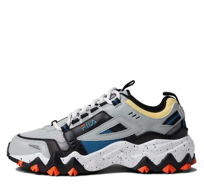 Grey with black yellow and blue accents lace up chunky sneaker on white background.