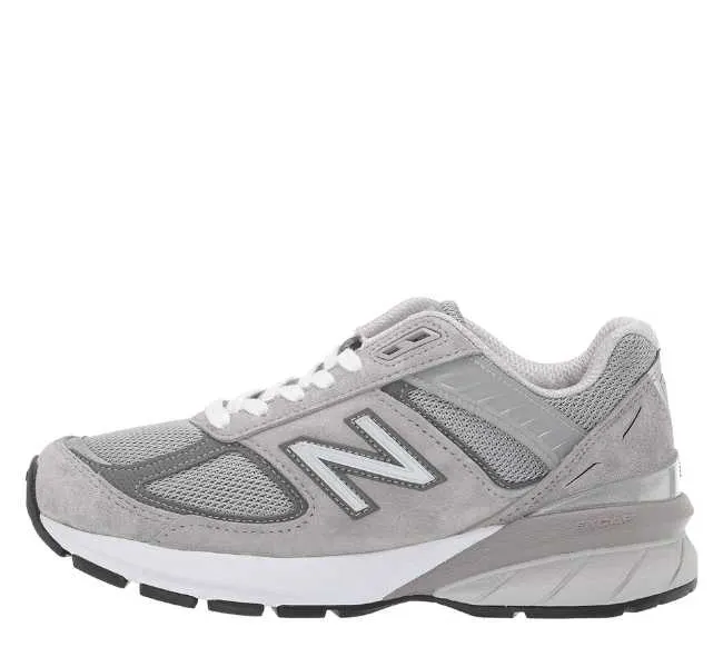 Various greys lace up sneaker on white background.