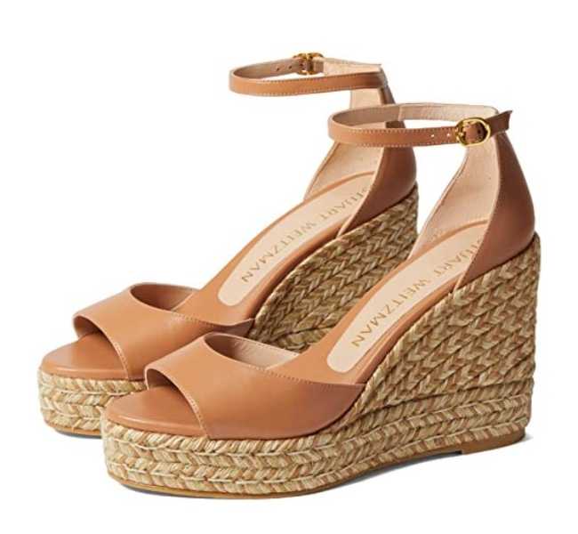Tan leather open toe espadrille wedge heels on white background.