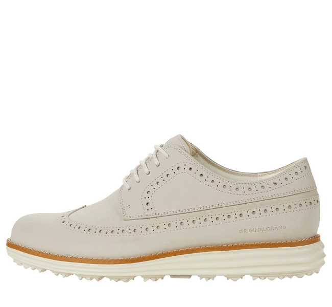White leather lace up oxfords on white background.