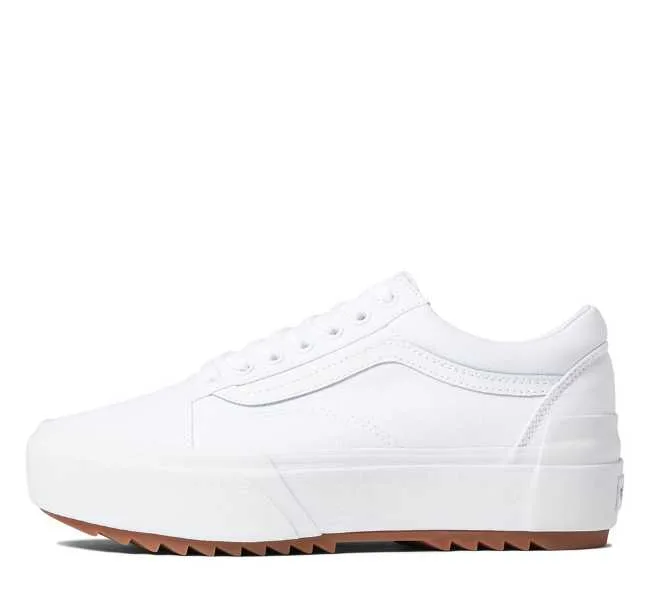 White lace up platform sneaker on white background.