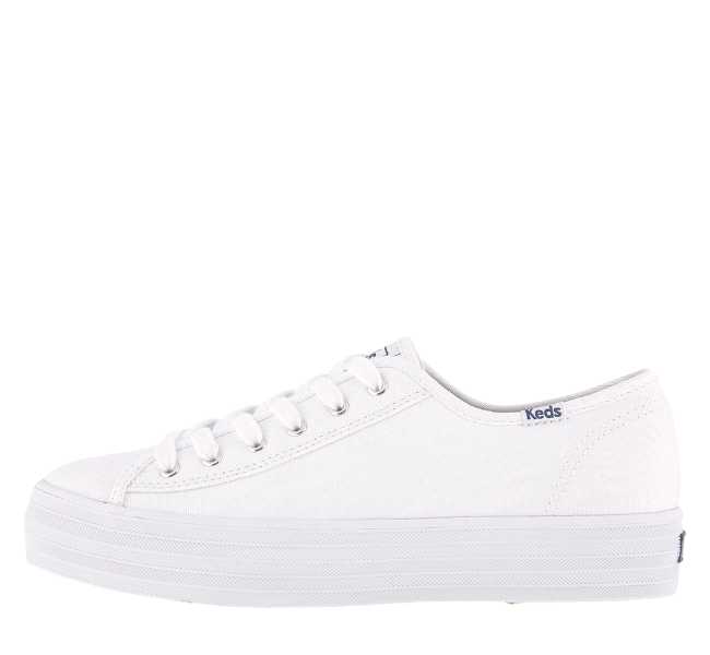 White canvas lace up sneaker on white background.