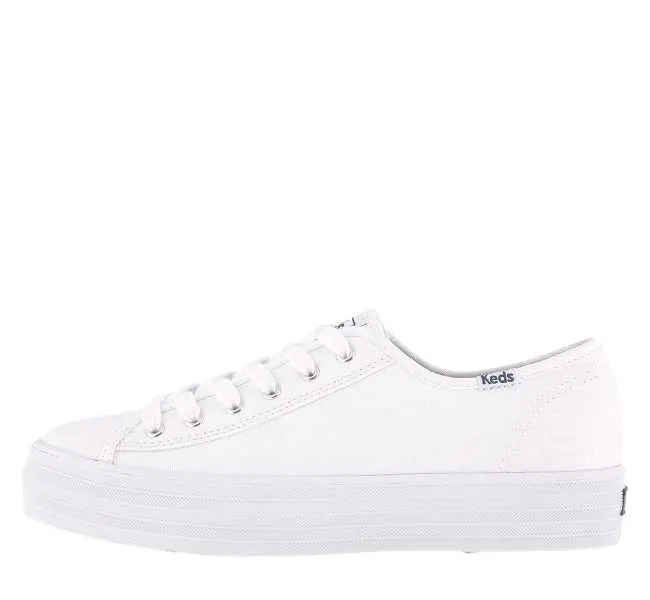 White canvas lace up sneaker on white background.