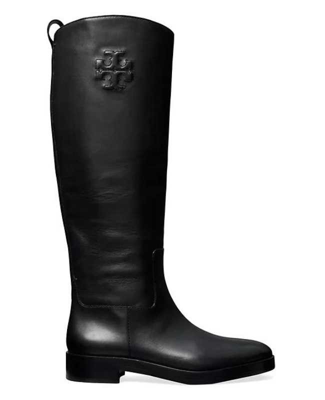Black leather knee length riding boot on white background.