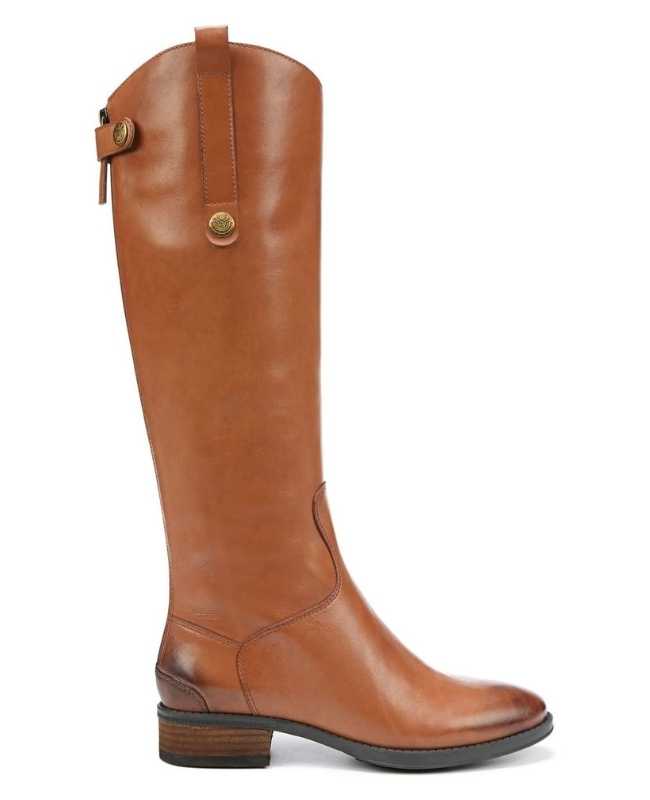Brown leather riding boot on white background.