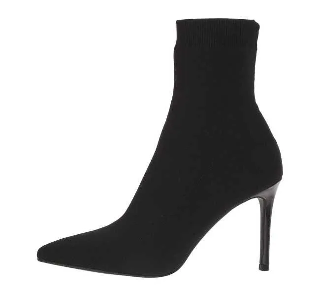 Black pointed toe ankle length sock boot on white background.