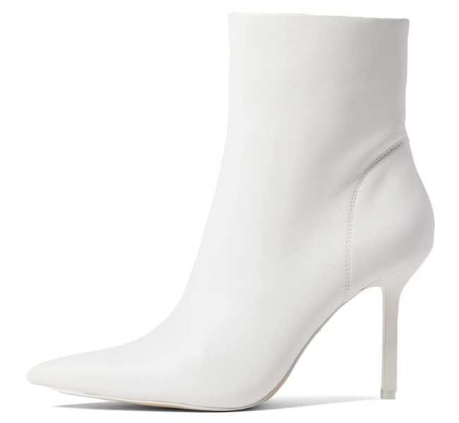 White pointed toe ankle boot on white background.