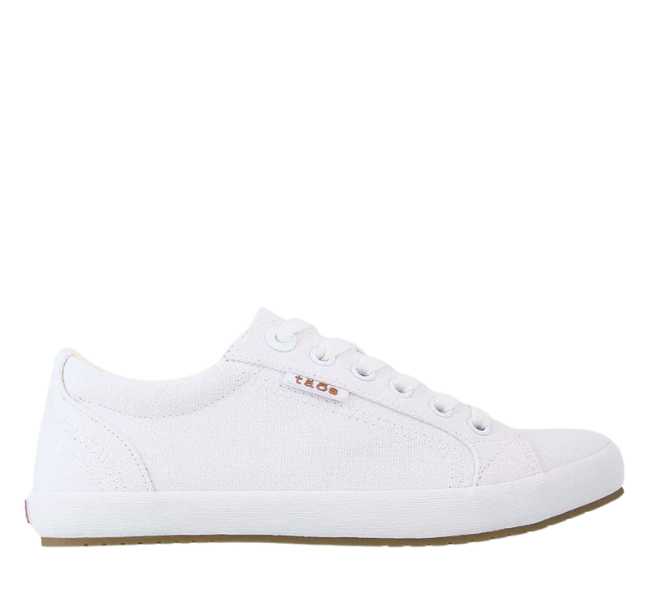 White canvas lace up sneaker on white background.