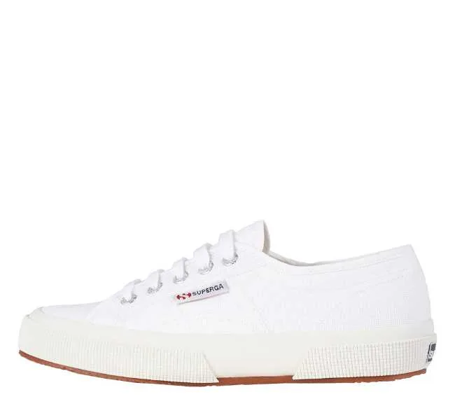 White canvas lace up sneaker on white background.