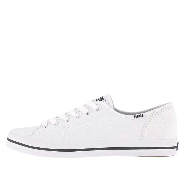 White canvas lace up sneaker on white background.