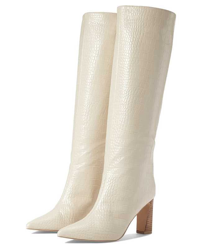 White snakeskin print knee boots on white background.