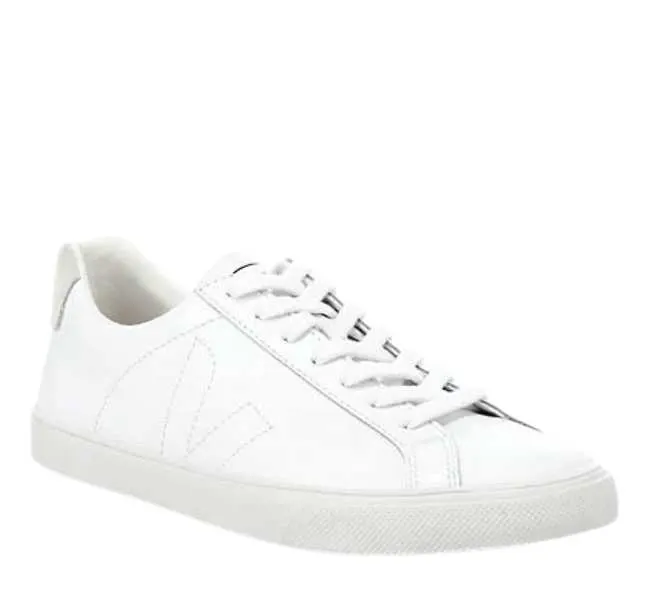 White leather lace up sneaker on white background.