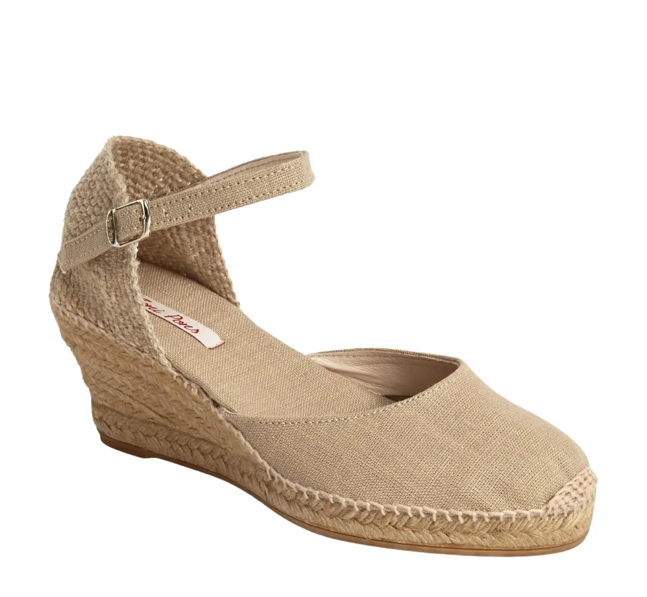 Beige closed toe fabric espadrille with ankle strap on white background.